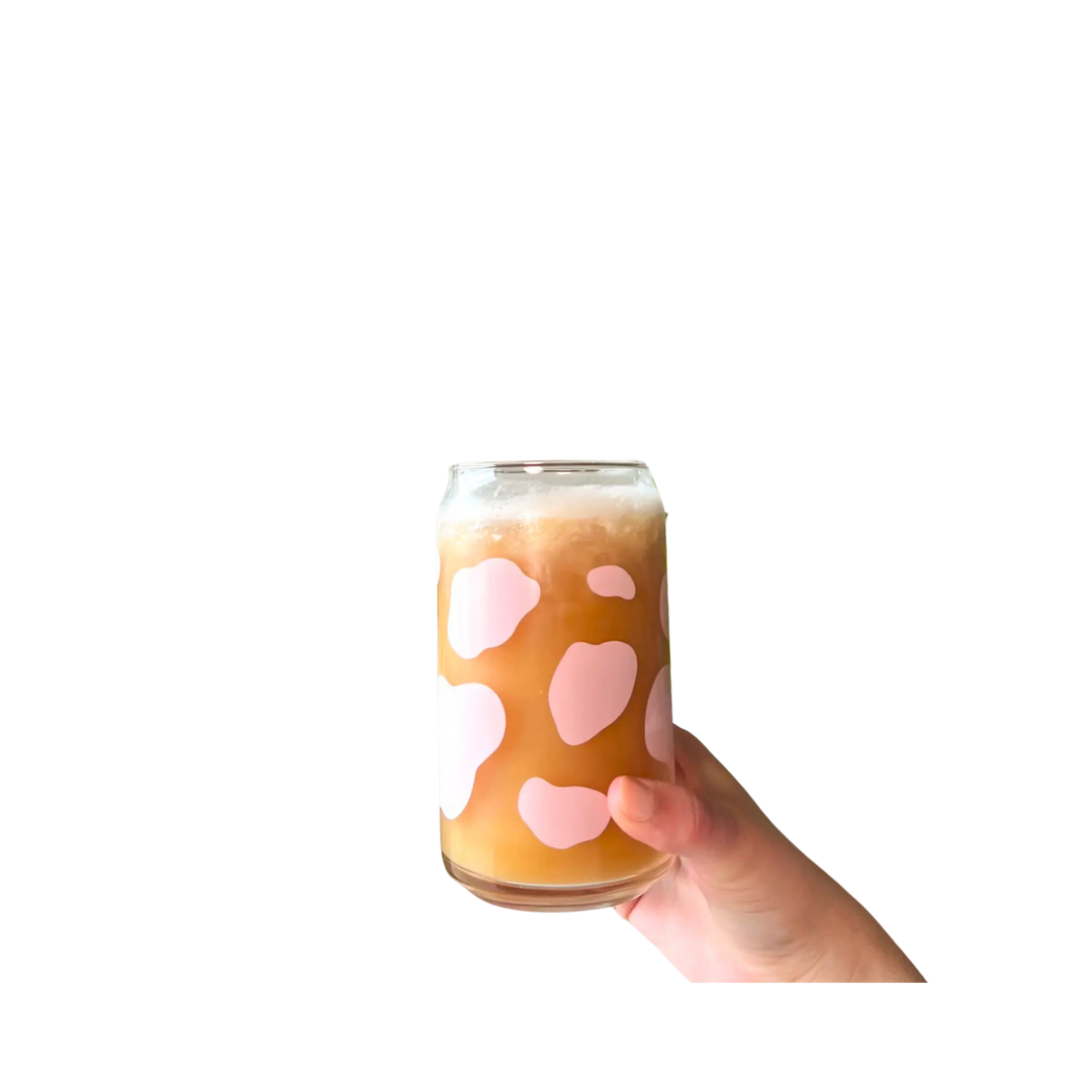 Glass cup with pink cow print. This 16 oz can glass cup is a great choice for hot and cold beverages. Its cow print design is printed seamlessly around the glass with high-quality, durable ink for long-lasting durability. Plus, it is dishwasher safe and can last through more than 300 dishwasher cycles on the top rack.