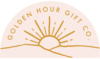 Gold hour gift co. logo - sun rising behind hills