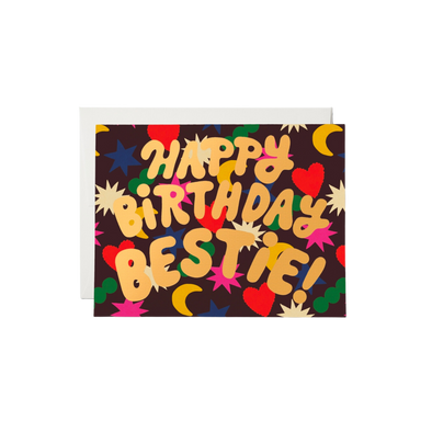Colorful shapes on black background with gold text "Happy Birthday Bestie!". This heavy-weight, 100lb card stock is printed and foil stamped. Its dimensions measure at 4.25 by 5.5 inches. Artwork is illustrated by Krista Perry and the card is printed on recycled paper in the USA. It is blank inside.