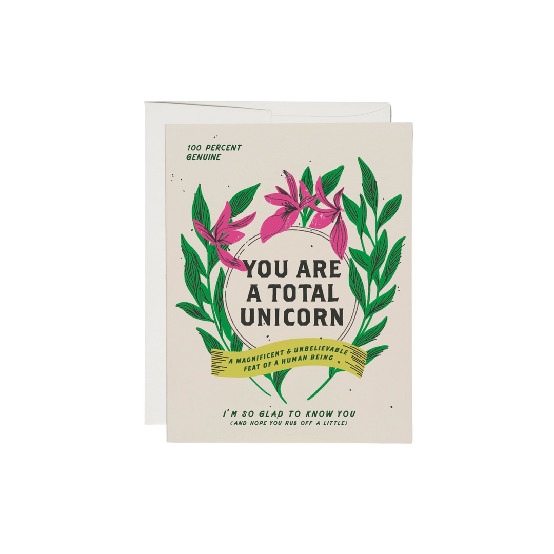 Green and Pink floral design on white background with text reading "You Are a Total Unicorn. Im So Glad To Know You (And Hope You Rub Off A Little". 100lb heavy card stock is offset printed. 4.25 x 5.5 inches in size. Illustrated by Dylan Mierzwinski and crafted in the USA.